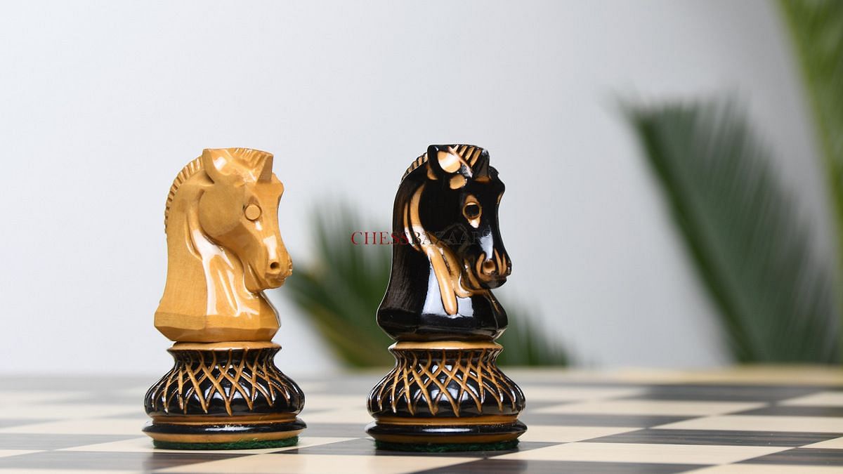 A closer view of Dubrovnik chess knights made from lacquer-finished burnt and natural boxwood