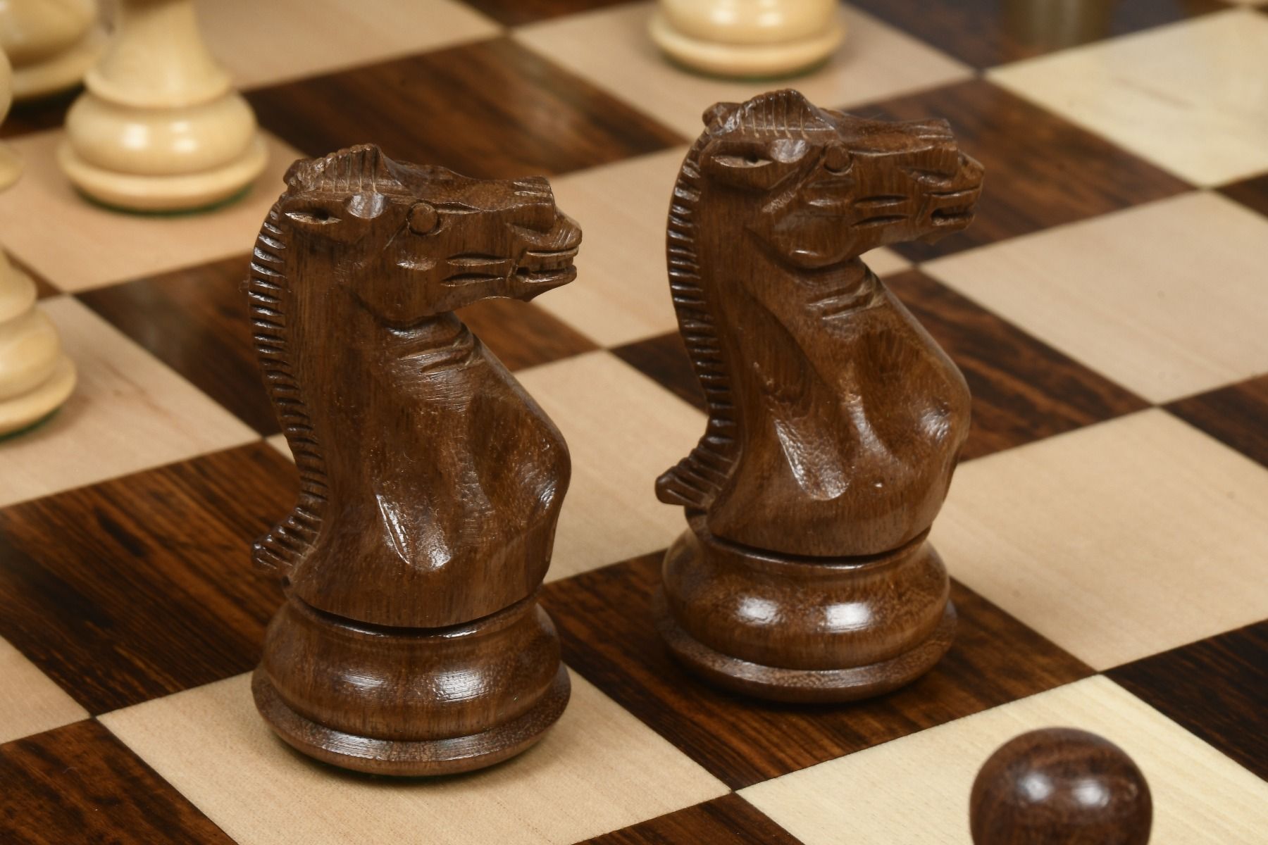 Two Staunton pattern Knight chess pieces in Sheesham 