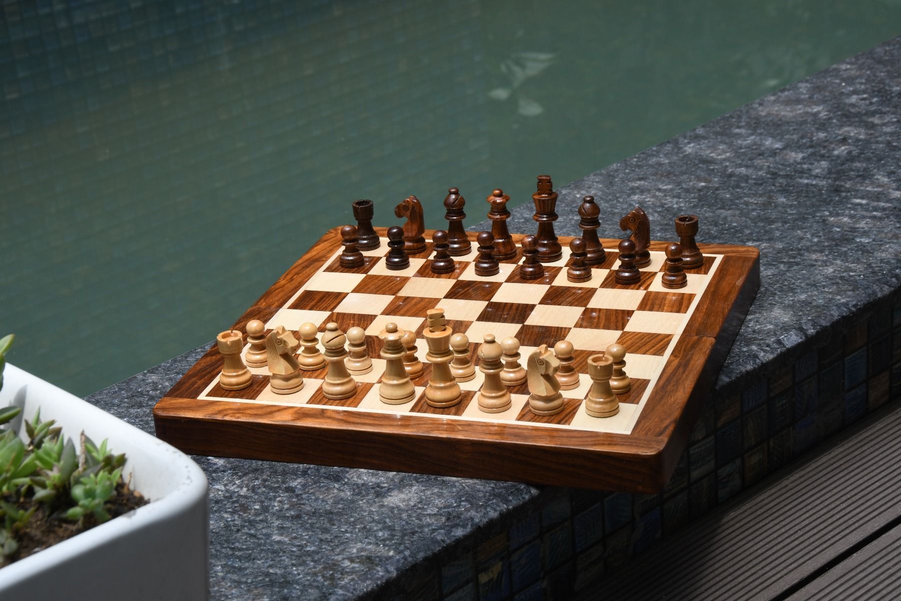 12" portable magnetic chess set at poolside